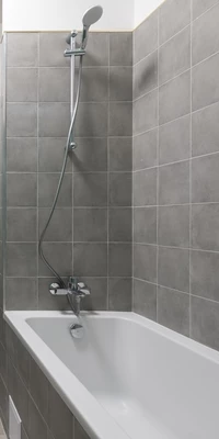 Bath tub in grey bathroom