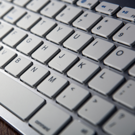 Close-up photo of a white computer keyboard