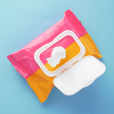 Photo of an open pack of wet wipes in a half yellow, half pink packet.