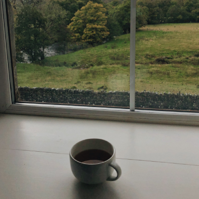 Photo of a cup of tea on a windowsill