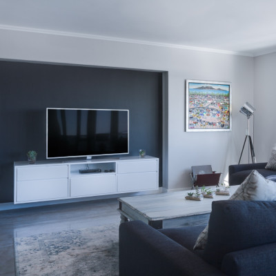 Photo of a modern living room taken facing the television