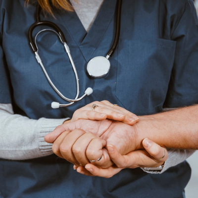 Nurse holding hands