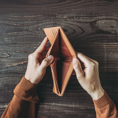 Man holding empty wallet