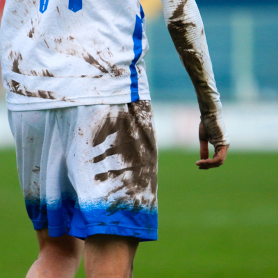 Person with a dirty football kit