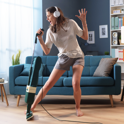 Woman singing into vacuum