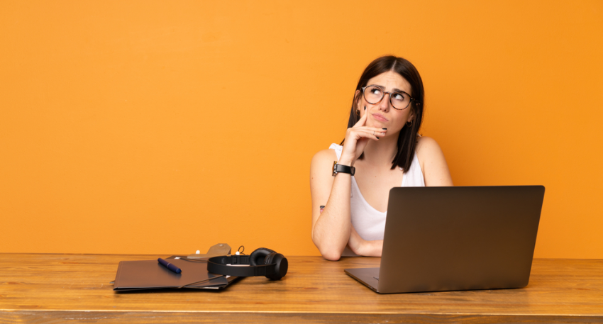 Woman sat looking confused