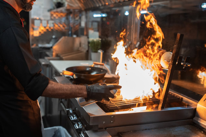 Man cooking with fire