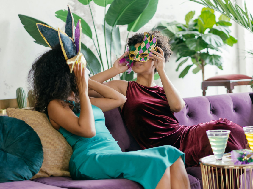 Two ladies chatting on velvet sofa