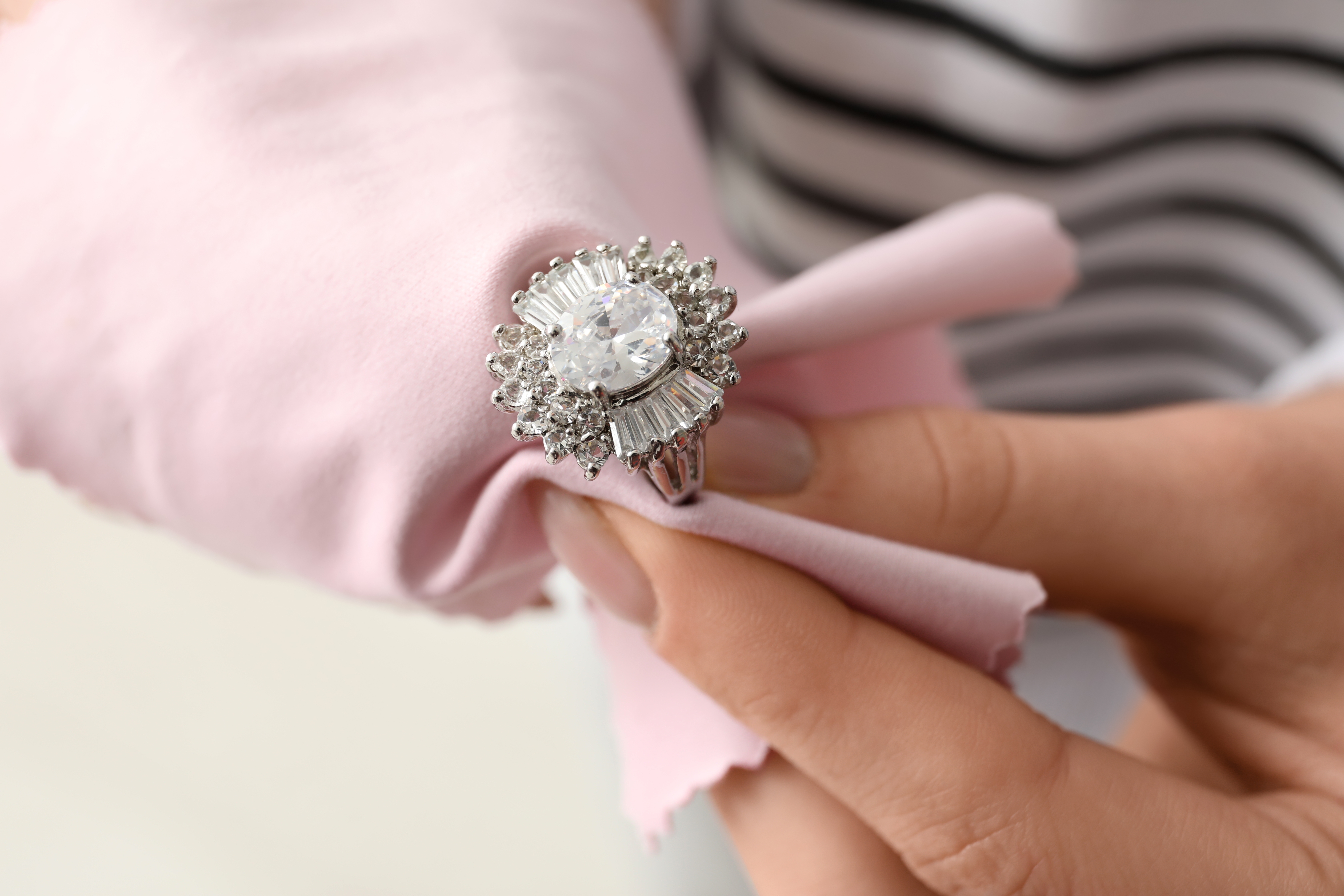 Polishing a silver ring with a cloth