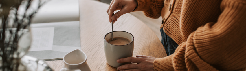 Woman mixing a cup of tea