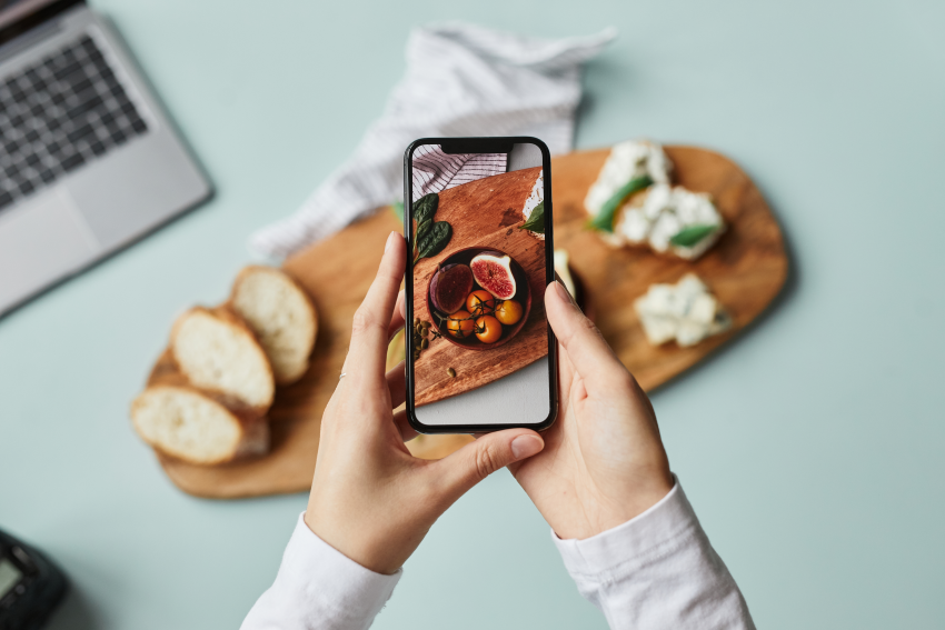 Person taking picture of food