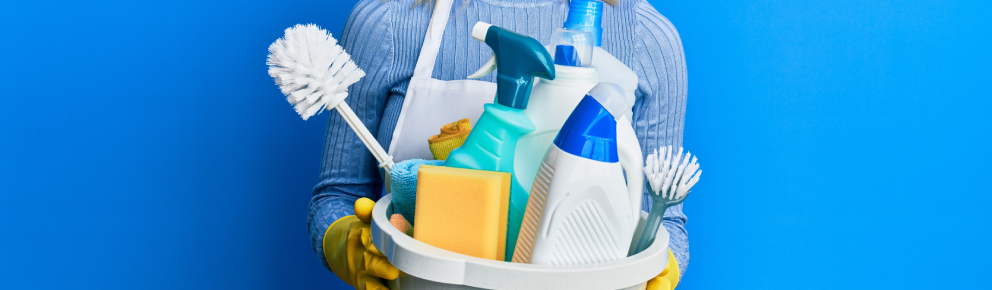 Woman holding cleaning supplies