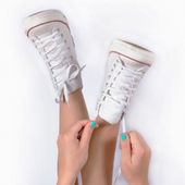 Young woman wearing white Converse