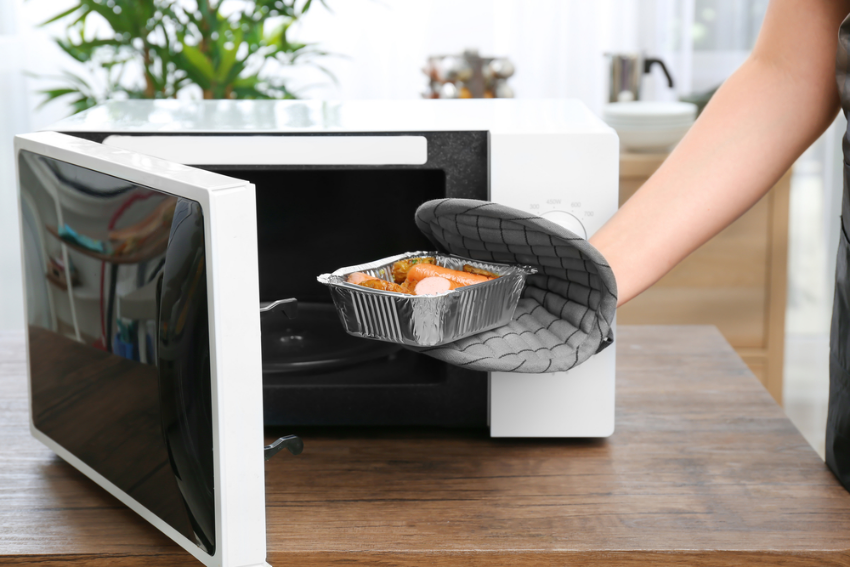 Person using a microwave
