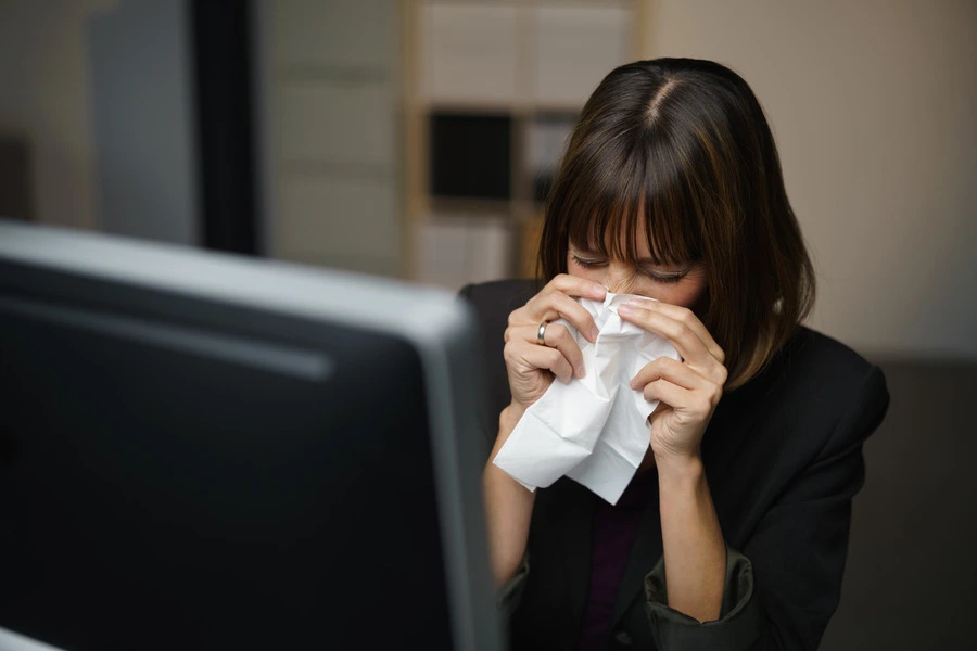 Lady with flu in suit