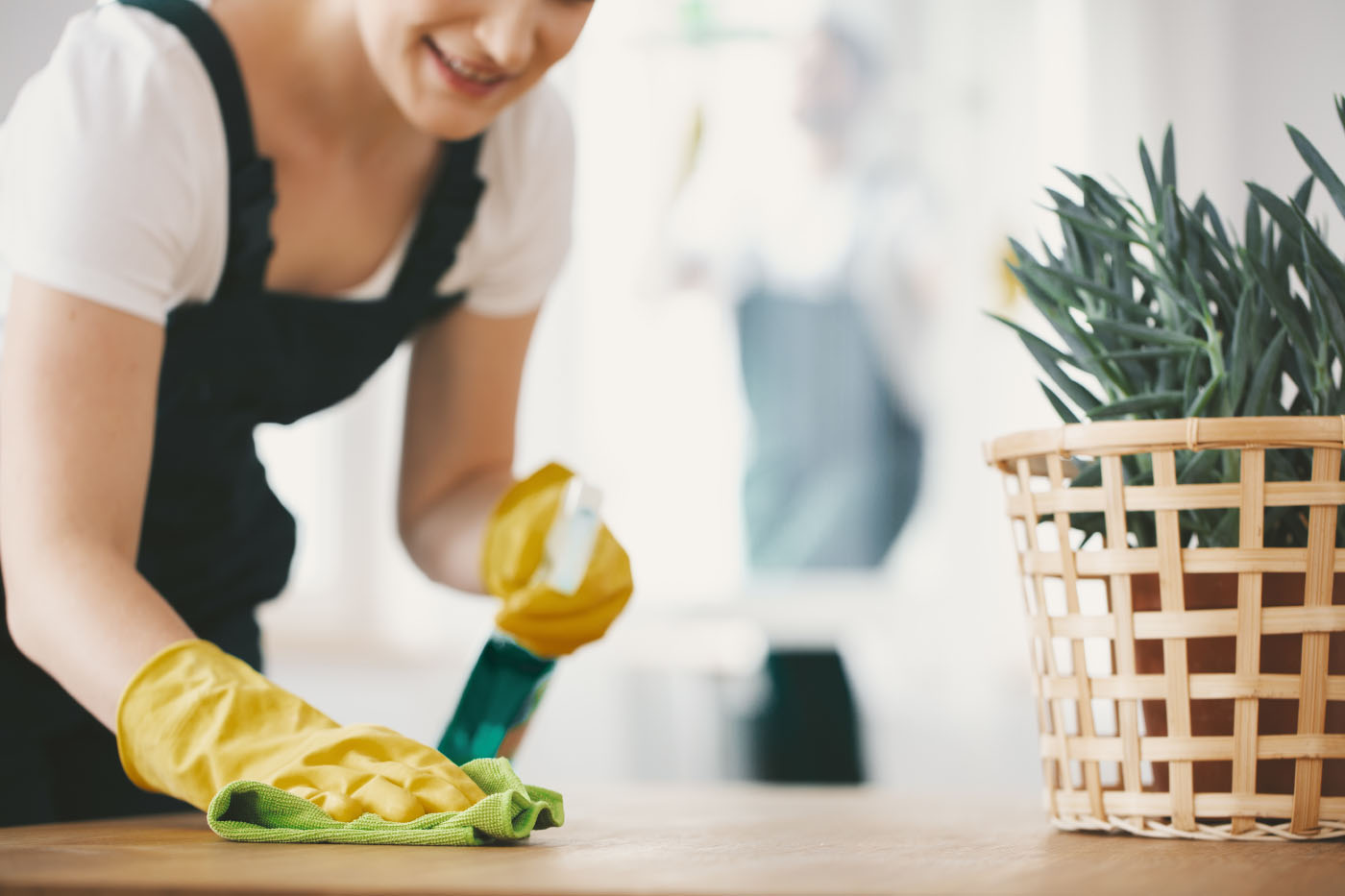 Woman cleaning wooden surface