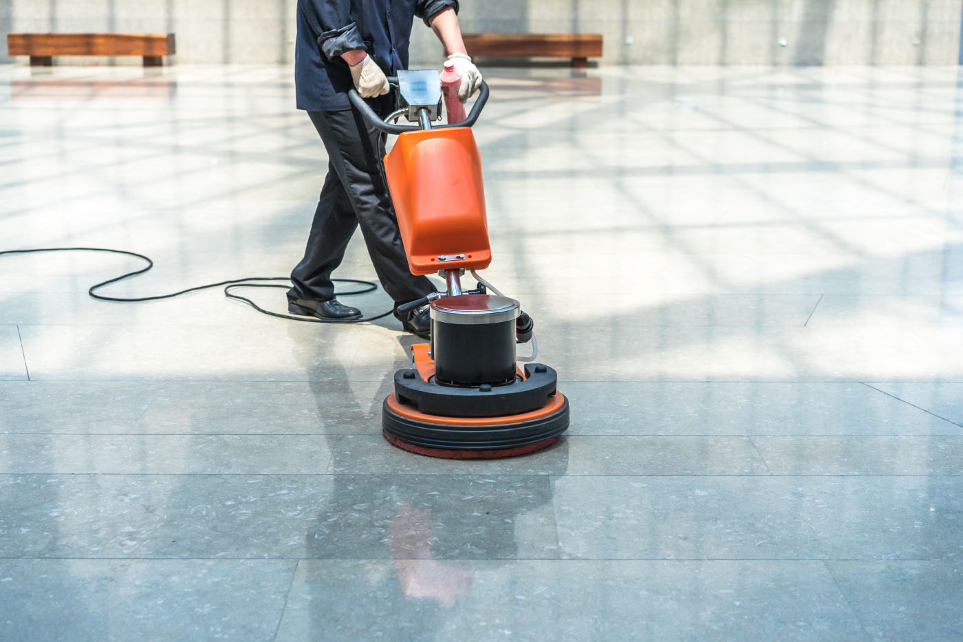 Man using floor scrubber-dryer